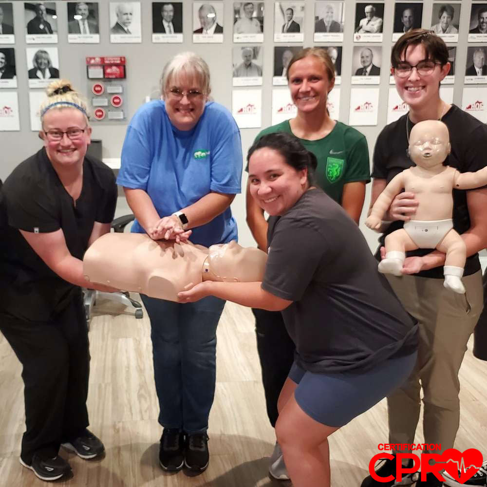 CPR training class in Austin with students practicing on mannequins.