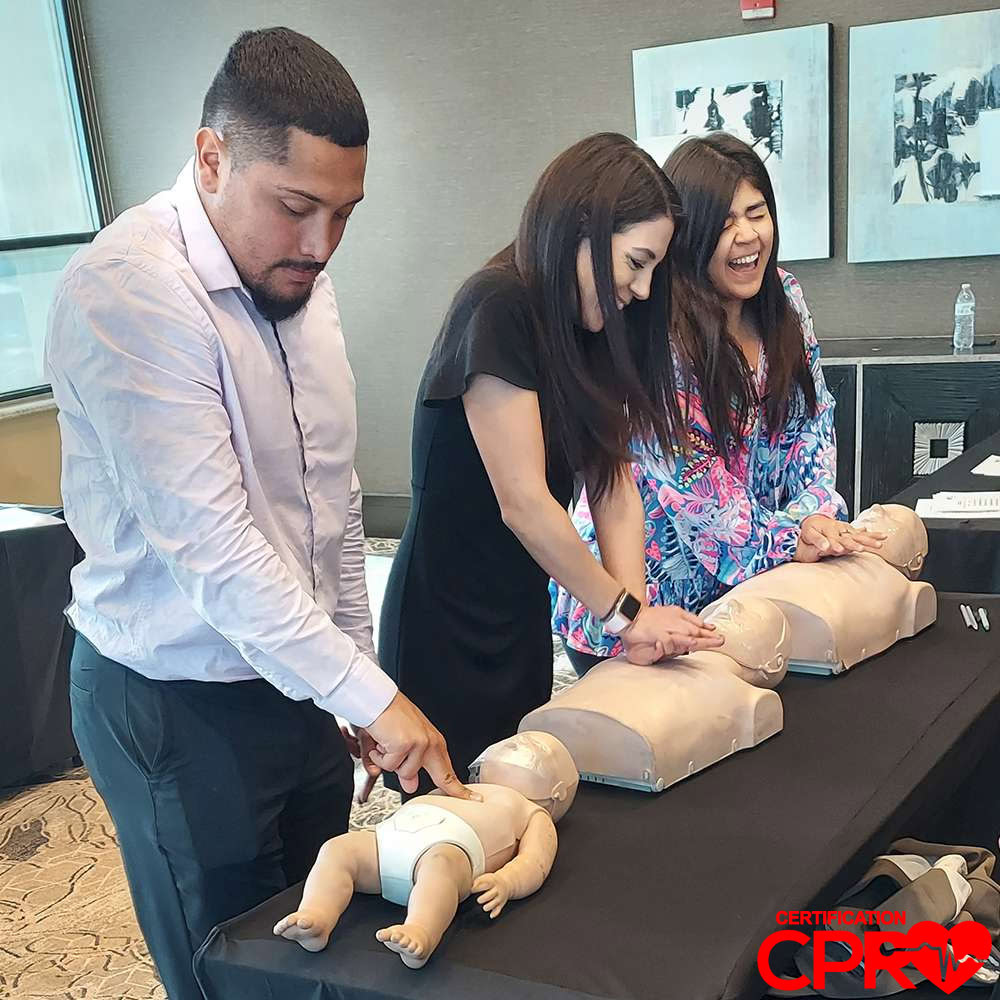 CPR training class in Austin with students practicing on mannequins.